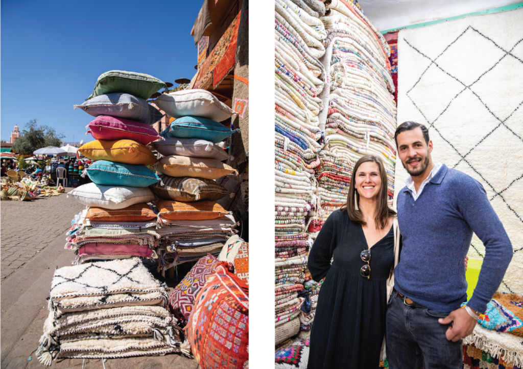 a bright display of colored turkish pillows and Sarah and friend standing next to a large stack of turkish towells
